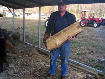 Carrying log of firewood